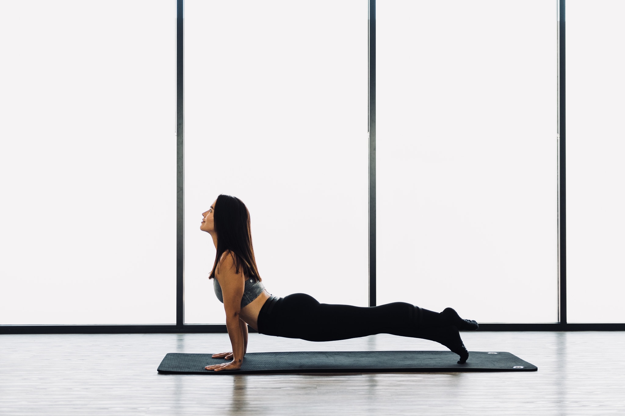 Marion Conaghan, performing pilates stretch